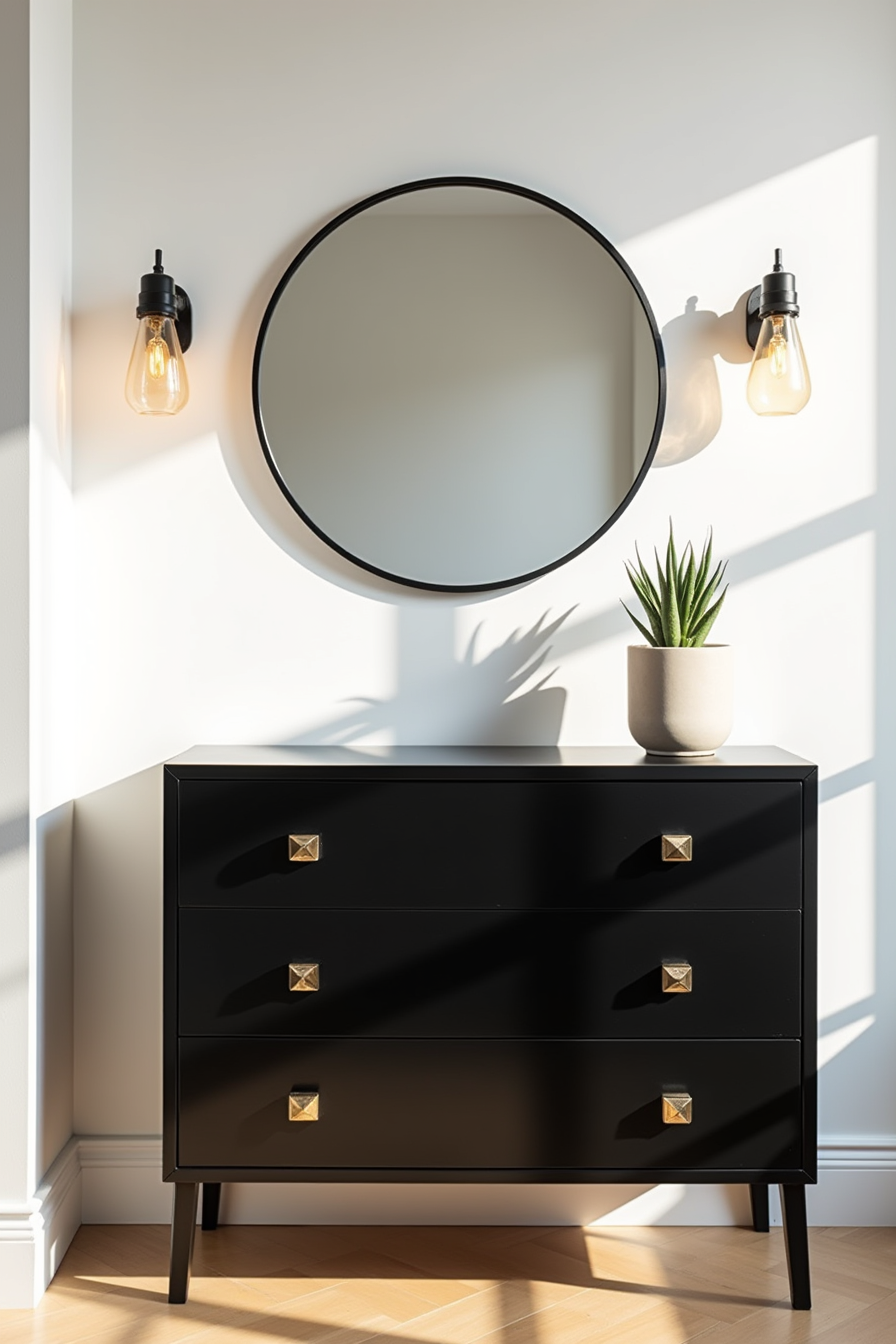 Glossy black dresser with geometric pulls below a round mirror, topped with a potted succulent.