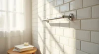White subway tiles with evenly spaced grout lines and a chrome towel bar in a corner bathroom.