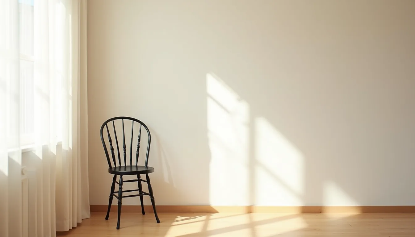 Iron chair with spindle back casting a sharp shadow on a neutral wall.