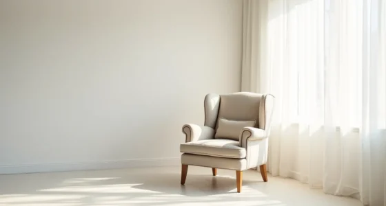 Wingback chair with rolled armrests and wooden legs viewed from above in a white corner, casting shadows on the floor.