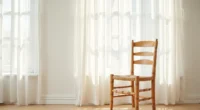 Wooden chair with turned legs and woven rush seat against a neutral wall, viewed from three-quarter angle.