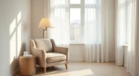 Overhead view of a centered upholstered armchair with round side table, floor lamp, and woven storage basket in a small pale